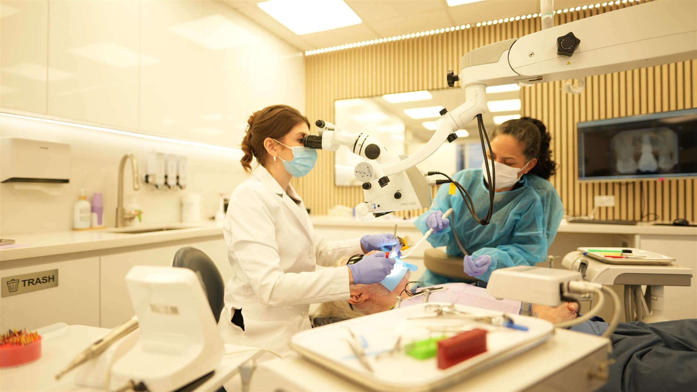 Modern endodontic treatment room with microscope at Biologic Endodontics